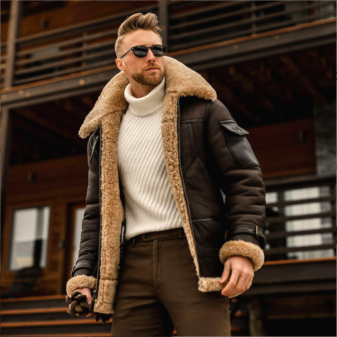 Dark brown zip-front jacket with tan fleece-style trim worn over a cream sweater