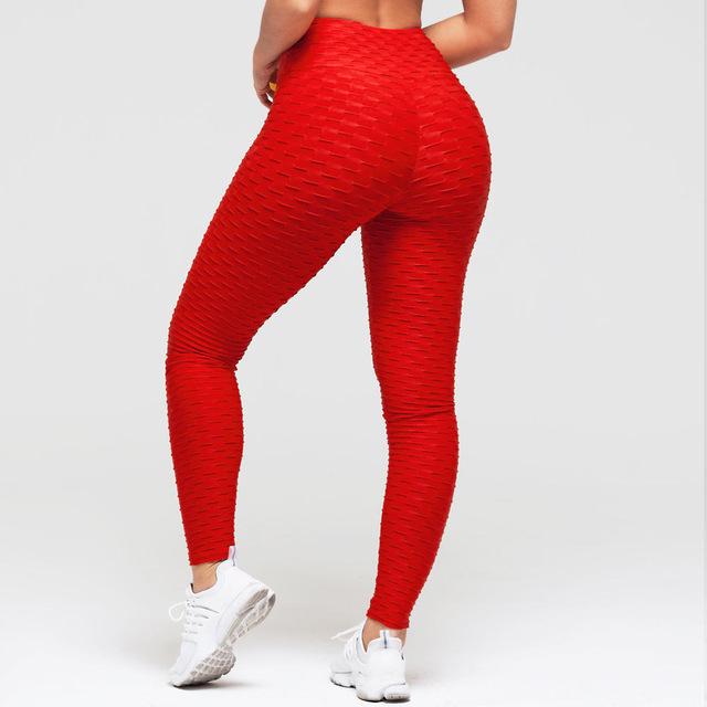 Red textured high-waist scrunch leggings shown from the back with white sneakers
