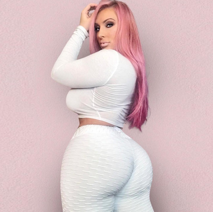 White textured leggings shown from the back with a white long-sleeve top