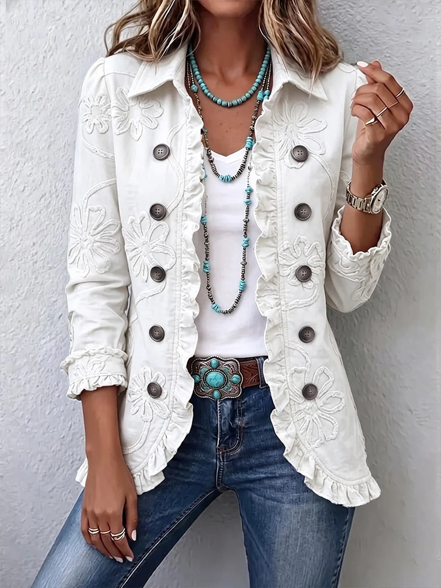 White floral-detail jacket with ruffled edges worn over a white top