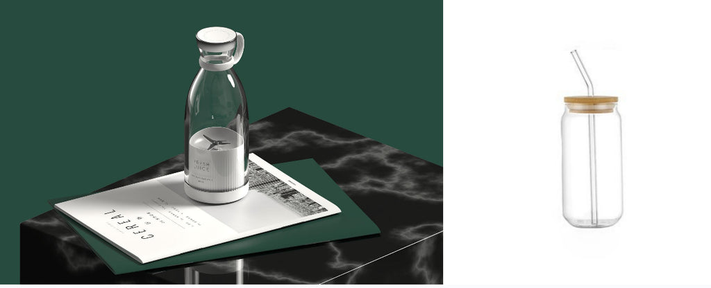 White portable blender pictured beside a straw drinking glass
