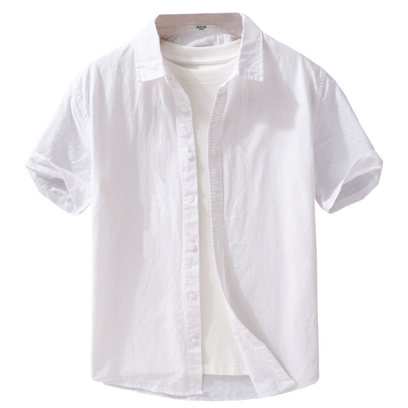 White button-front shirt with short sleeves isolated on white over a T-shirt