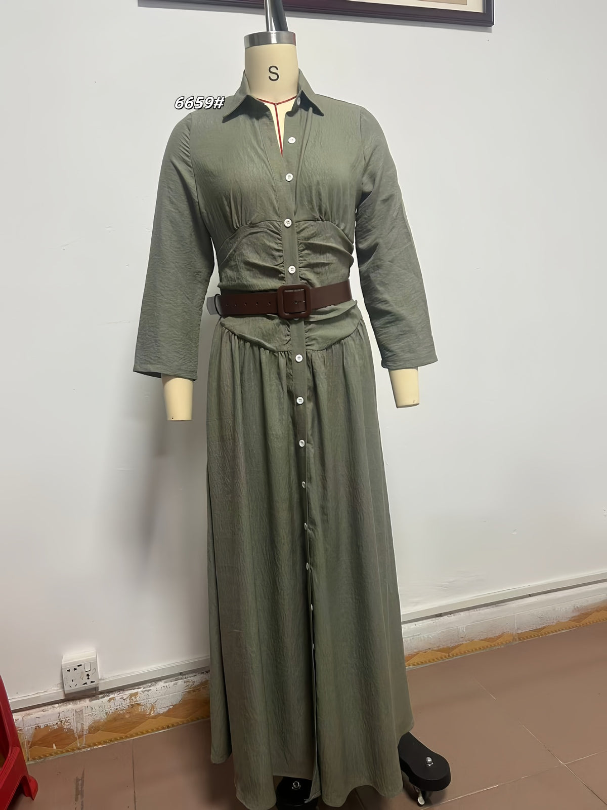 Olive button-front maxi shirt dress on a mannequin with three-quarter sleeves