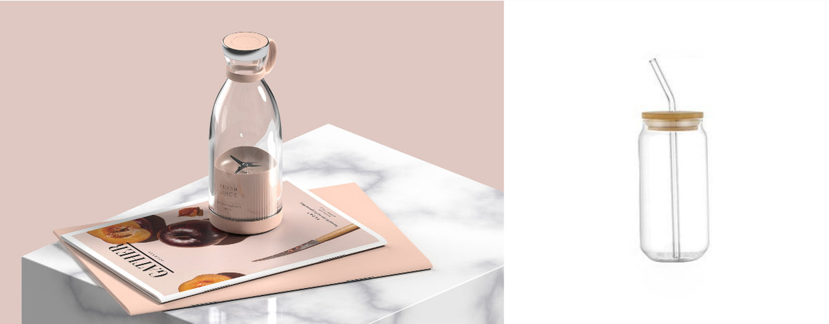 Pink portable blender pictured beside a straw drinking glass